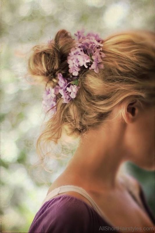 Bun Hairstyle With Flowers