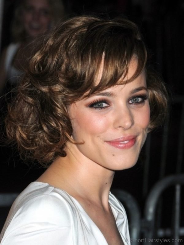 Celebrity Short Wavy Curly Hairstyle with Side Swept Bangs